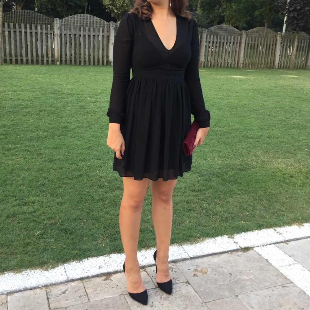 Michael Kors black sheer dress. Does not show through since it is layered.